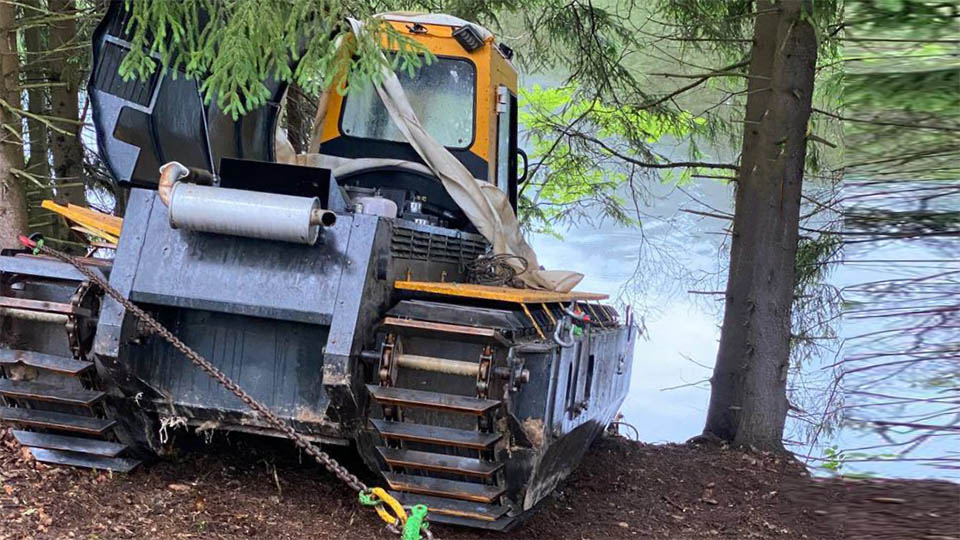 cleaning the bottom of a reservoir, deepening the pond with a dredger